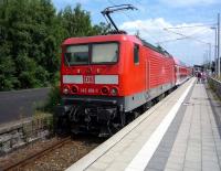 A Lubeck to Travemunde Strand service pauses briefly at Travemunde Hafen station during the early afternoon of 26 July 2010.<br><br>[John Steven 26/07/2010]