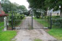 The gated entrance to the former Helmsley station on 26 September 2010. Located on the Moors midway between the ECML and Pickering, Helmsley was opened by the North Eastern Railway in 1871 and closed by BR in 1953. [See image 19609] The old station is now an imposing private residence. <br><br>[John Furnevel 26/09/2010]