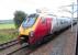 An Edinburgh-bound Virgin Voyager between Carstairs South and East Junctions on 28 August 2010.  Photograped from a Glasgow Central - North Berwick Class 322, halted at signals east of Carstairs station to let it pass.<br><br>[David Panton 28/08/2010]
