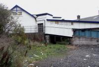 Renovation of the 1847 terminus building at Burntisland is complete.<br>
It has been sympathetically restored and converted into office suites.Behind the scenes however things look a little less formal. The roof of the 1847 building can be seen to the right. At an angle on the left is the 1890 platform building, still in use and staffed. The walkway behind the fence gives access to the Up platform when the ticket office is closed, and the covered ramp lead down to Harbour Place. It's obvious that a structure which was attached to it has recently been removed.<br><br>[David Panton 10/10/2010]