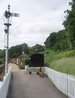Two stations for the price of one. This is the approach to Norchard Low Level, at the headquarters of the Dean Forest Railway.  The station was built in the preservation era and, behind and above the platform buildings, the High Level station that was opened in conjunction with the reopening of the line to Parkend can be seen.<br><br>[Mark Bartlett 12/06/2010]