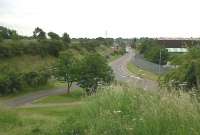 The Bermuda industrial estate has seen a number of measures to reduce carbon emissions - a cycle path, new footpaths, traffic lights on a major roundabout. A new station is scheduled for completion in December 2013 - about where the approaching 153 can be seen in the centre background of this south-facing view. Notice the curve of the road in the foreground - this is the approximate course of the old branch line to the Bermuda collieries.<br><br>[Ken Strachan 18/06/2010]