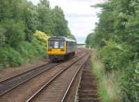 142012 leaves Hindley heading for Manchester via Bolton. Ahead of the unit is Crow Nest Junction, still controlled by a mechanical signalbox, where the direct line to Manchester via Atherton splits from the Westhoughton and Bolton line. The other rails on this former four track main line were to the right of the island platform from which this picture was taken. <br><br>[Mark Bartlett 09/07/2010]