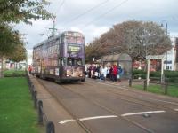 <I>Temporary tram terminus</I>. During extensive refurbishments in Fleetwood town centre, and by the Ferry Terminal, trams are temporarily terminating at the Ash St stop at the end of Lord Street. Here a sizeable crowd of Saturday shoppers is waiting to catch a tram back towards Blackpool as double decker 707 reverses over the points. <br><br>[Mark Bartlett 16/10/2010]