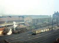 Steam more dead than alive in this mid 1960s shot from London Road showing the south side of St Margarets shed, with V2 60816 centre-stage. Note the wagons dropping below ground level for spent ash collection, and, in the right background, the downwind (and long-suffering) flats on Restalrig Road North.<br><br>[Frank Spaven Collection (Courtesy David Spaven) //]