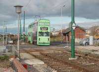 With new platforms under construction in the foreground, tram 762 rumbles across the crossing at Rossall School. 762 is one of the <I>Jubilee</I> class of two trams that were rebuilt with East Lancs bodies and which seemed considerably larger than all the other trams in the fleet. After withdrawal in 2011 it moved to the National Tramway museum at Crich. The large waiting shelter at this tram stop was demolished when the new halt was completed. [See image 22575] for the same view eighteen months earlier.<br><br>[Mark Bartlett 16/10/2010]