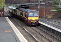 320 320 approaches Shettleston station on 16 October with a Helensburgh Central service. It is on top of the points <br>
for the loop which can be seen in the background. This is mainly used for reversing short workings from the west [see image 19614]. None of these is scheduled to terminate at or originate from Shettleston.<br><br>[David Panton 16/10/2010]