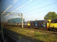 Colas Rail 47739 and DRS 20315 at the head of four of the stored former Jarvis Rail class 66 locomotives, nos 66305, 66302, 66301 & 66303, standing alongside the Gresty Bridge depot of DRS. [Since the photograph they should have been joined by 66304 from DRS Kingmoor.]<br>
As of 2013 all five class 66's are in DRS compass livery and are an active part of the DRS fleet.<br><br>[David Pesterfield 02/09/2010]