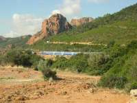 Two TGV sets cross near Pointe de Cap Roux on the line which skirts the Corniche d'Esterel, Cote d'Azur and is dominated by the distinctive red porphyry rocks more reminiscent of the scenery found in Wyoming. [Photo by Sue Chattwood.]<br><br>[Malcolm Chattwood 02/10/2010]