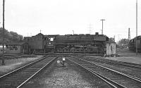 044-122 at Gelsenkirchen-Bismarck shed on 5 June 1976. Following recoaling/water/sands the engine ran onto the turntable, turned and was posiitoned on an adjacent siding ready for its next tour of duty.<br><br>[Peter Todd 05/06/1976]