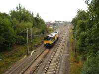 Colas Rail 66843 exits Daventry International Rail Freight Terminal  towards Rugby mid afternoon on 4 Aug 2010 with 66954 visible to the left and 66412 further along the sidings.<br><br>[David Pesterfield 04/08/2010]