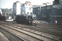 Fairburn 2-6-4T no 42203, recently arrived from Polmadie shed, reverses into Glasgow Central to pick up a local train on 5 September 1959. Meantime, in the left background, Stanier Pacific no 46244 <i>King George VI</i> gets into the right mood to take out the <I>Mid-Day Scot</I> for London Euston. <br><br>[A Snapper (Courtesy Bruce McCartney) 05/09/1959]