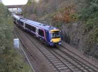 170 459 approaches Springburn station with a service from Glasgow Queen Street High Level on 16 October. It has just cleared the cord from Cowlairs South Junction which curves sharply to the left.Going off to the right (and heading north) are the lines to Cowlairs West Junction and the EGML. They have no passenger services though for a while, before the cord was laid in 1993, trains from Glasgow to Cumbernauld would reverse after clearing West Junction and use this line. It was either that or get an electric from Queen Street Low Level and change at Springburn to a DMU going in the opposite direction [see image 19961].I think we can agree the cord was a boon.<br>
<br>
<br><br>[David Panton 16/10/2010]