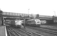 The north end of Carlisle in late 1968 sees a 'Peak' leaving on the 10.25am  Leeds - Glasgow Central with a type 2 standing at platform 7 with the 1pm Carlisle - Edinburgh Waverley via Hawick.<br><br>[K A Gray //1968]