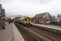 An early afternoon train from Leeds to Carlisle, formed by 3-car set 158755, calls at Settle at the start of the <I>Long Drag</I> climb to Ais Gill summit. With 1050hp on tap for the three coaches however the gradient isn't the challenge it once was.<br><br>[Mark Bartlett 23/10/2010]