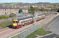 334 034 runs west past the site of Polkemmet Junction with a driver training run on 25 October 2010<br><br>[James Young 25/10/2010]