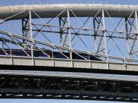 A 125 going east over the Royal Albert Bridge at Saltash on the 3rd of May 2009. Part of the deck of the much newer road bridge is seen directly below Brunel's iconic structure.<br><br>[Neville Davies 03/05/2009]