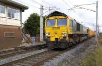 View north at Hest Bank on 19 October 2010 as 66616 passes with the 6U68 Carlisle - Mountsorrel empty ballast train.<br>
<br><br>[Bill Roberton 19/10/2010]