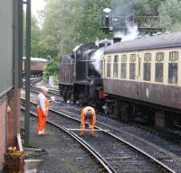 PW checks being carried out at the entrance to Pickering station on 26 September 2010 as ex-Somerset & Dorset 2-8-0 no 53809 gets a green with a morning train for Whitby.<br><br>[John Furnevel 26/09/2010]