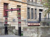 The endearingly modest entrance to Cessnock Subway station seen on 16 October. Were it not for the modern Subway sign out on Paisley Road West it wouldn't be obvious to the stranger what this was. It looks as if the tenements date from the same time as the station, 1896.<br>
<br><br>[David Panton 16/10/2010]