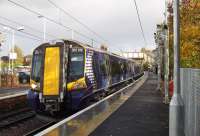 Soon to be a common sight, 380105 at the head of a two unit set at Johnstone on a test run of ScotRail's new Desiro Express trains before entry into service, currently planned for mid November. On the rear is 380107 which made the train too long for the platform as both are four car sets and Johnstone has been extended to take seven car units. When the trains enter service they will run as single units, 3+3 or 3+4 sets.<br><br>[Graham Morgan 27/10/2010]