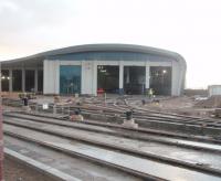 Track is now in place on several roads at the new Starr Gate tram depot, seen here on 27 October 2010. The rails in the foreground are the new running lines, with the depot sidings behind, as seen through the <I>Heras</I> fencing that surrounds the construction site.<br><br>[Mark Bartlett 27/10/2010]