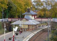 Maxwell Park station is neatly framed by roads. It is here <br>
photographed from the westerly bridge, looking east towards central <br>
Glasgow on 16 October. What kind of area is Maxwell Park? Let's just say you're more likely to see a waxed jacket and tweed cap or a <br>
headscarf on the platform here than you are at most other inner SPT <br>
stations you care to mention.<br>
<br><br>[David Panton 16/10/2010]