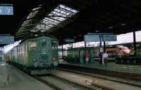 Lausanne with a local and a TGV in 1991. I was on my way to Geneva and, I think, jumped onto the local.<br><br>[Ewan Crawford 26/07/1991]