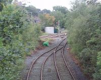 The junction where the short freight branch from the Ribble Cement works joins the Blackburn to Hellifield line is seen here from an overbridge on the branch, as is the end of the run round loop. The signal box is just off to the right and this is also the point where terminating trains from Manchester reverse before dropping back to Clitheroe station. [See image 18737]<br><br>[Mark Bartlett 16/09/2010]