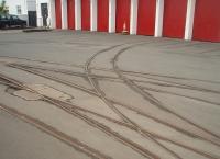 A close up of the complicated pointwork outside the Douglas Horse Tram depot at Derby Castle. The possible reasons behind such a layout are fascinating, especially when viewed against the fact that the trams are double ended vehicles and <I>run round</I> involves the horse walking from one end of the car to the other wherever it is situated. As can be seen a few of the depot roads are no longer connected - what was the layout when they were? [See image 30994].<br><br>[Mark Bartlett 08/10/2010]