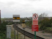 A class 150 inches over the viaduct into Barry Island station. The track on the right belongs to the Barry Steam Railway.<br><br>[John Thorn 28/10/2010]