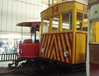 The world's oldest electric tramcar still in regular use at Derby Castle depot alongside a <I>younger creation.</I> MER No.1 dates from 1893 and is still much in demand for special workings, although as my guide pointed out sister car No.2 is exactly the same age - it just isn't No.1. Alongside this veteran is works vehicle No.34, converted from a Snaefell Mountain Railway vehicle and fitted with a diesel generator so that it can run on the MER when the current is switched off. Picture with kind permission of MER engineering staff.<br><br>[Mark Bartlett 08/10/2010]