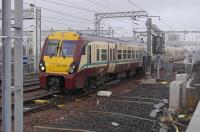 334 021 heads for the yard at Bathgate (New) prior to returning west.<br><br>[Bill Roberton 02/11/2010]