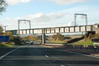 Birdsmill (M8) Viaduct seen from the east. Still a strange sight to me with the electrification masts. Just to the east of here is the second Birdsmill Viaduct which crosses the Almond Water. Joys of being a passenger with a camera.<br><br>[Ewan Crawford 31/10/2010]