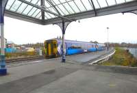 156501 forming the 13.12 Glasgow Central - Carlisle service restarts from Kilmarnock on 5 November passing the former south bay platform.<br><br>[Ken Browne 05/11/2010]