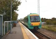 Winchelsea station on the Ashford to Hastings line is about 3/4 <br>
mile from the former Cinque Port town that it serves. On 26 October 2010, unit 171724 is seen heading east over the level crossing towards Ashford. As with many other stations at the western end of the line, most trains do not stop here.<br>
<br><br>[John McIntyre 26/10/2010]