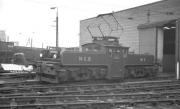 NCB electric locomotive no 9 (AEG 1565 built in Germany in 1913) photographed outside the NCB's shed and workshops at Westoe Colliery, South Shields, around 1959. The colliery finally closed in 1993 and this locomotive is now preserved on the Tanfield Railway.<br>
<br><br>[K A Gray //1959]