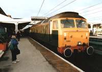 47500 attached to the rear of a Kings Cross - Leeds class 91 hauled service prepares to leave Wakefield Westgate in November 1991 as a young assistant struggles valiantly with the photographic equipment. The train is about to depart on the final leg of its journey to Leeds via Normanton. <br><br>[David Pesterfield 23/11/1991]