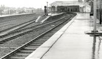 View south on a rainy day at Kilmarnock station circa 1985, showing the Glasgow and Ayr bay platforms<br><br>[Ken Browne //1985]