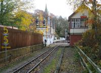 Approaching Alston station in November 2010, with the spire of St Augustine's church towering above the station building.<br><br>[John Furnevel 01/11/2010]