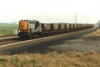 09014 hauls an MGR rake south at Burton Salmon on 7 March 1997. The wagons are on their way to Knottingley for servicing.<br><br>[David Pesterfield 07/03/1997]