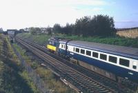 View west on the ECML towards Prestonpans in the 1980s as a BR InterCity 125 HST passes heading south.<br><br>[Jim Peebles //]