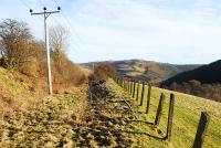 The view east along the trackbed of the Peebles Railway towards Clovenfords in January 2009. The location is high above the River Tweed in the vicinity of the former Angling Club Cottage - essentially a platform opened in 1898 to serve members of the Edinburgh Angling Club and eventually closed in the late 1940s. [See image 31488]<br><br>[Ewan Crawford 17/01/2009]