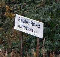 Easter Road Junction [see image 17507] was situated right at Easter Road station (closed 1947) at the other end of the curve from Abbeyhill Junction. This line allowed trains through Waverley direct access to Leith and Granton, succeeding the more direct cable-hauled line through Scotland Street tunnel. This curve line closed around 20 years ago after it was decided not to electrify the Abbeyhill loop. Nevertheless the sign still stands in November 2010, overlooking the Powderhall branch and no points.<br><br>[David Panton 13/11/2010]