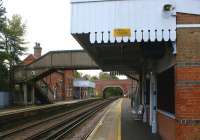 Looking south east along the up platform at Charing in Kent on 28 October 2010. Note the canopy of the waiting shelter, which appears to have had its awning trimmed. Compare with the same canopy awning on the down platform which has not received the same treatment.<br><br>[John McIntyre 28/10/2010]