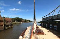 View from a Norfolk <i>Wherry</i> passing the opened Reedham Swing bridge, which carries the Norwich - Lowestoft line, in July 2010.<br><br>[Ian Dinmore 09/07/2010]