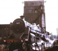 BR Standard Class 4 4-6-0 no 75019 being turned at Rose Grove in May 1968 with the coaling plant forming the backdrop. Built at Swindon Works in 1952 the locomotive was withdrawn from Carnforth shed some 3 months after this photograph was taken and cut up at Campbells of Airdrie in November of that year.<br><br>[Jim Peebles /05/1968]