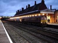 66207 has stoppped to make a crew change at Hereford on a return Cemex working to Peak Forest at 16.40 on 9 November 2010. Note the new high intensity platform lighting recently installed here.<br><br>[David Pesterfield 09/11/2010]