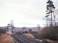Looking north towards Glenoglehead Crossing and its distinctively diminutive signal box during track-lifting operations on the Callander & Oban line in December 1966. Glenoglehead served as the station for Killin from 1870 until the branch opened in 1886, and survived just 5 more years as a public station - the loop however remained open until the end, splitting what would otherwise have been a 7 mile single-track section between Balquhidder and Killin Junction, much of it at 1 in 60 up Glen Ogle. [See image 19052] <br>
<br><br>[Frank Spaven Collection (Courtesy David Spaven) /12/1966]