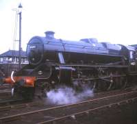 Stanier Black 5 4-6-0 no 44871 at Carnforth in August 1970. Carnforth Station Junction signal box stands in the background.<br><br>[Jim Peebles /08/1970]